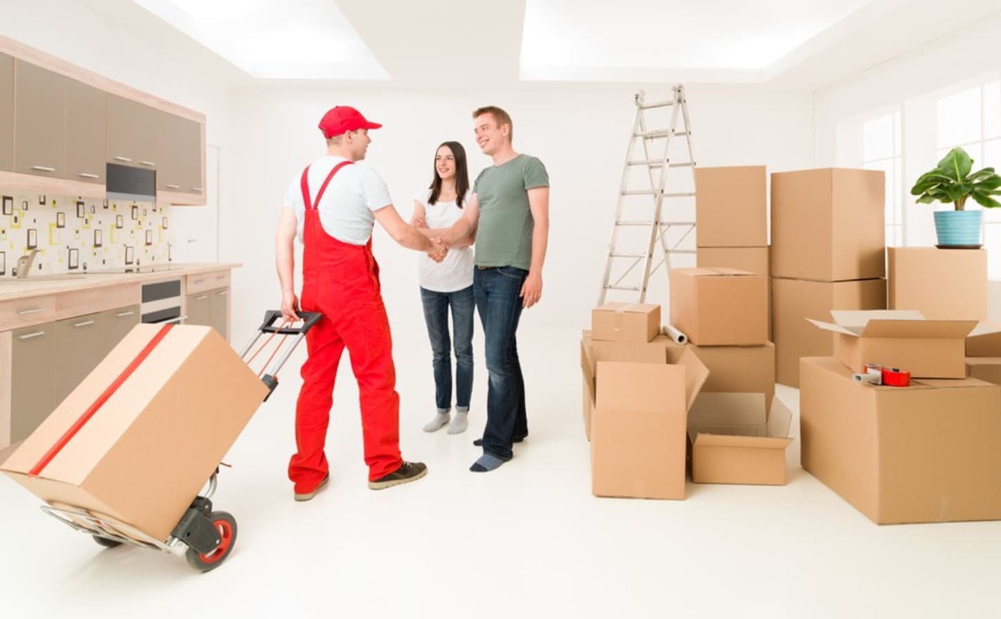 couple moving in new home and receiving package from delivery man